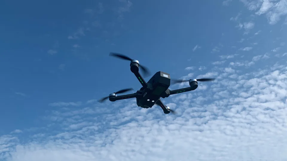 A quadcopter drone in flight